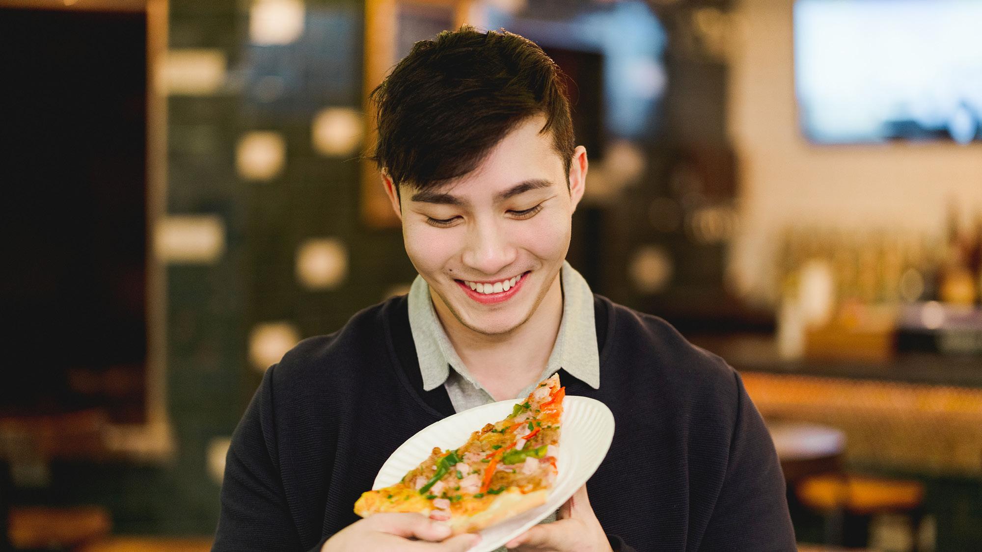 Turnstyle Underground Market man eating pizza