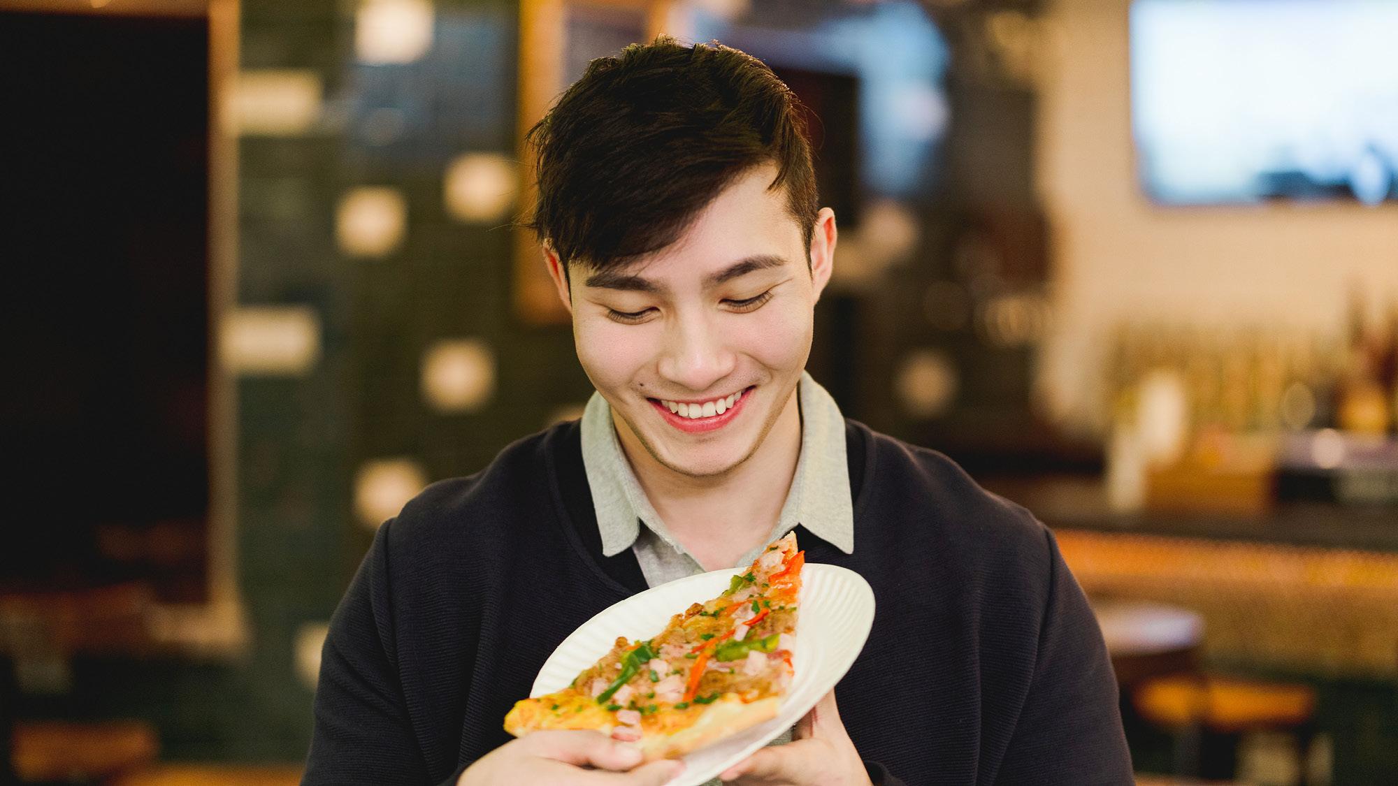 man eating pizza