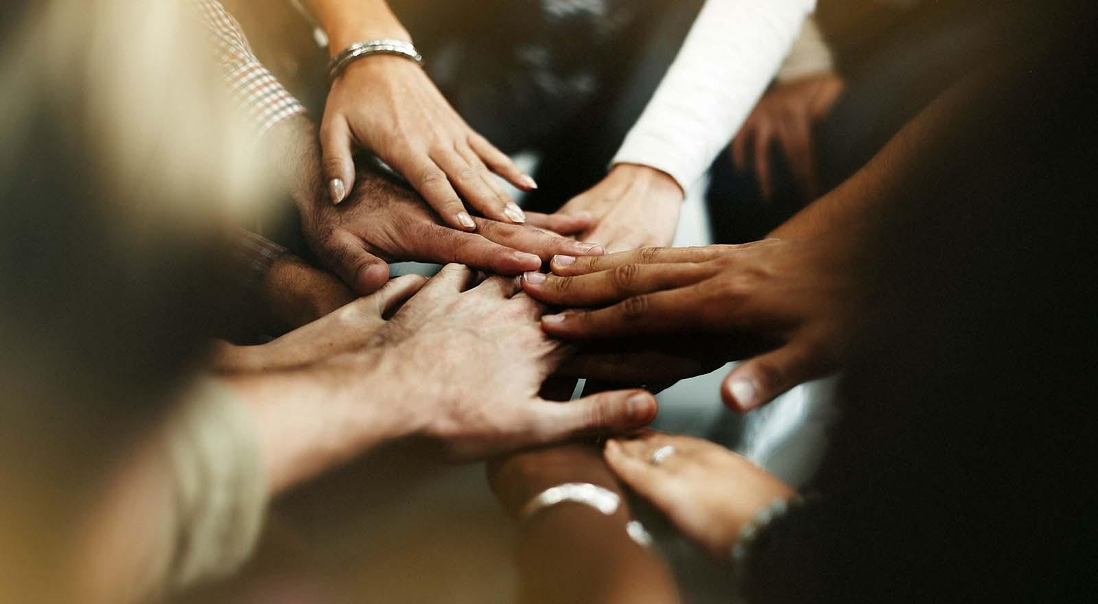 Scott Capital Advisors teamwork hands crossing