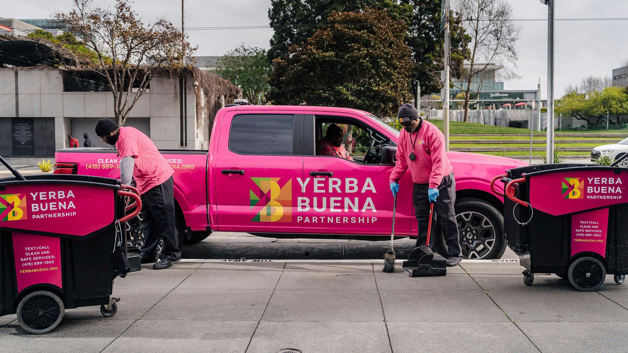 pink truck with clean up crew